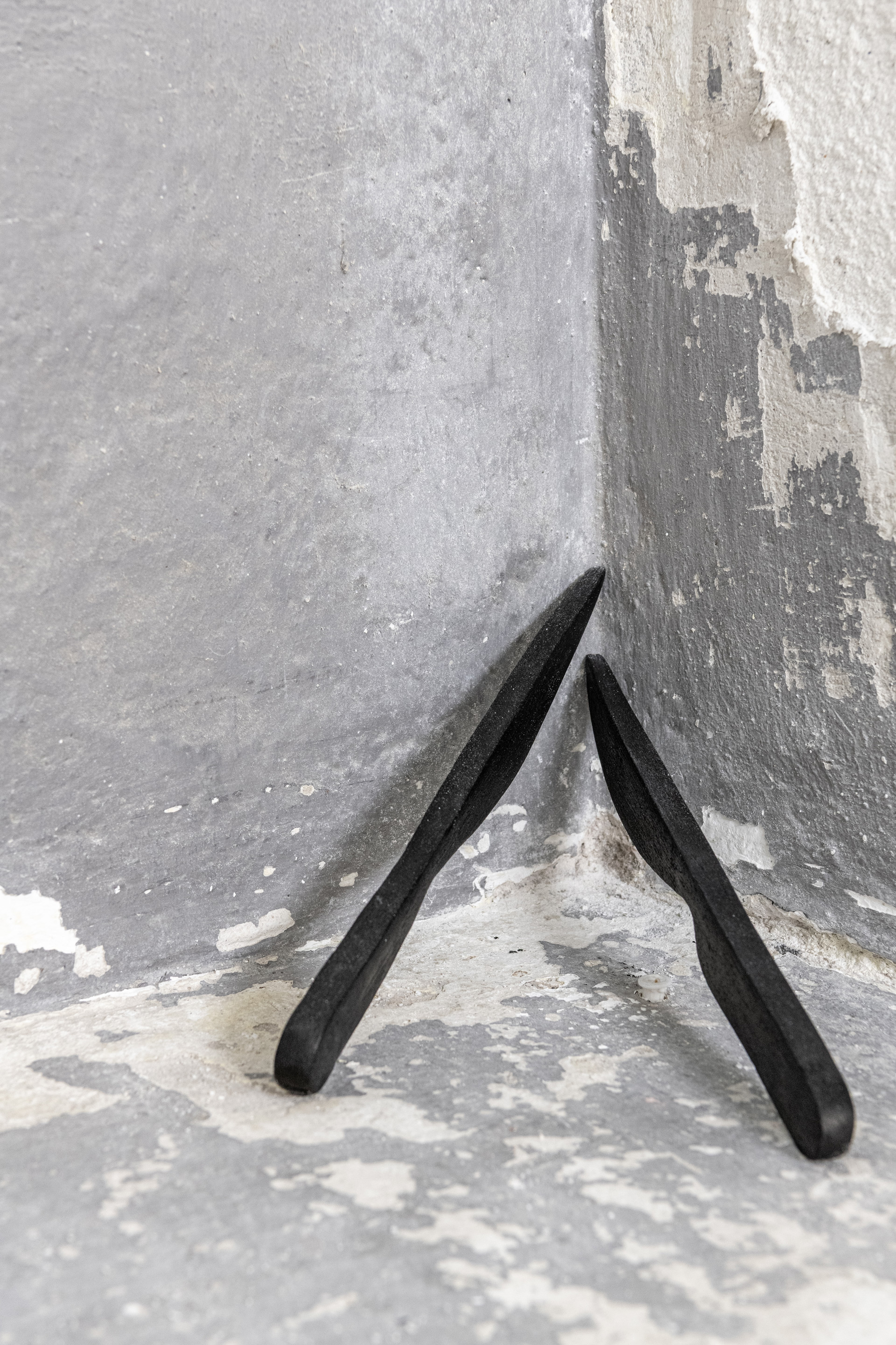 Céline Struger. Coyote knives (black) wallpiece, ceramics, 24 x 14 x 1 cm, 2025