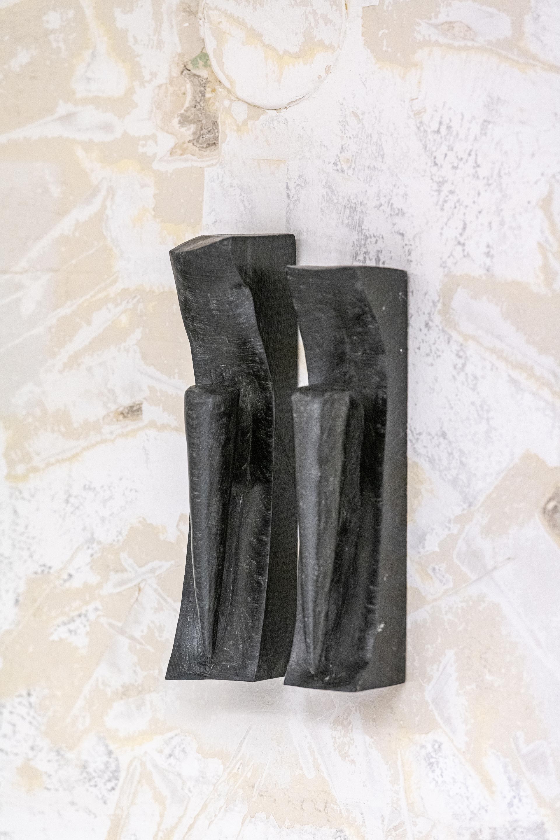 Sofiia Yesakova. Ugly scenes. Nuances 4.2. black wood, linseed oil, beeswax, 20 x 5 x 5 cm (x2), 2025. Close-up